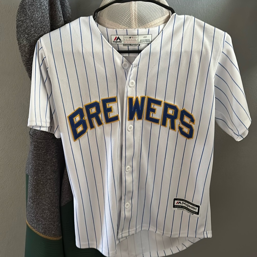 Multiple baseball and football jerseys and one basketball jersey